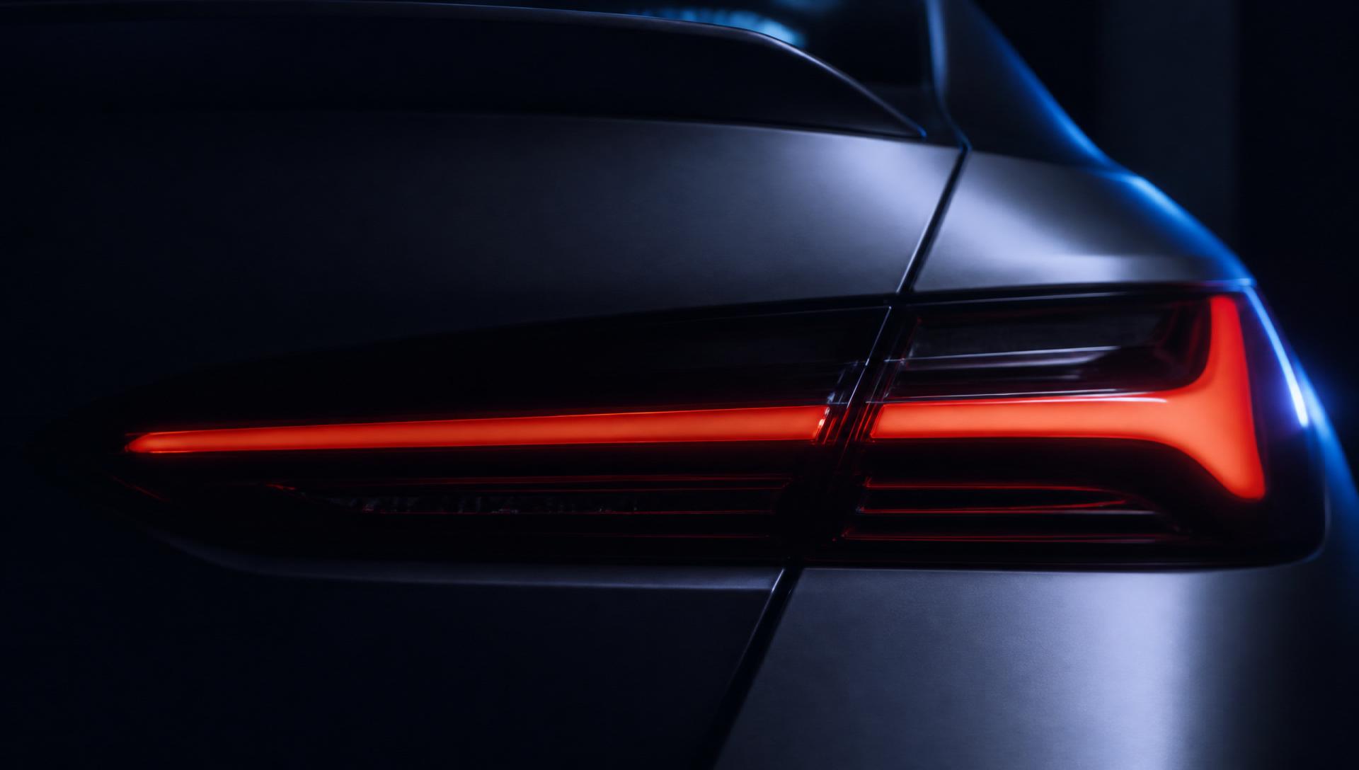 Close up of a freshly repaired car body panel and tail light